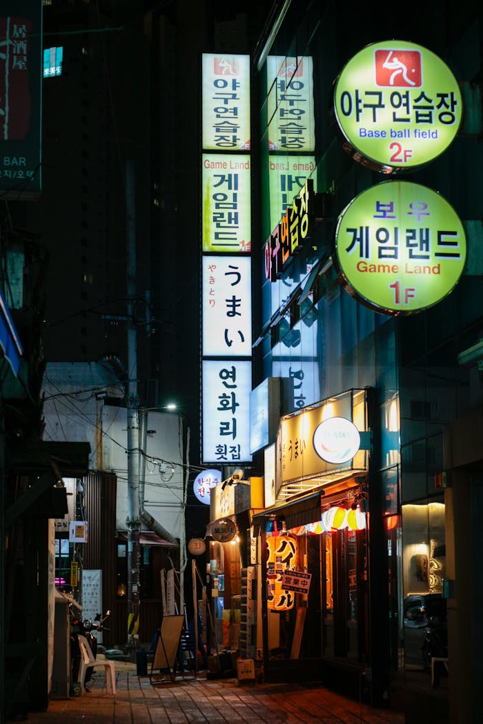 Urban scene showcasing colorful neon signs in a lively night street.